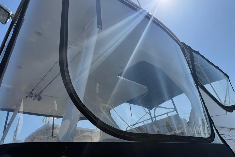 Slide: The Image of 2001 Bayliner 4087 Aft Cabin Motoryacht with sunlit windows and sleek design. - 58