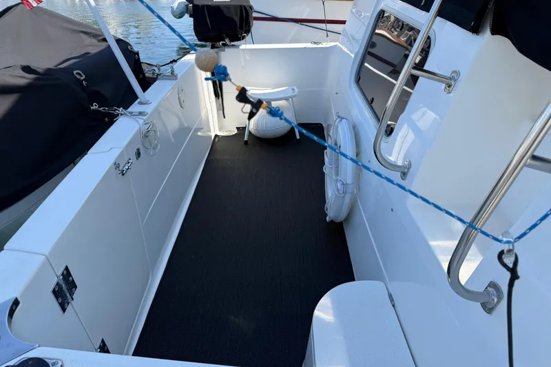 Slide: The Image of 2001 Bayliner 4087 Aft Cabin Motoryacht deck with seating and safety equipment. - 59