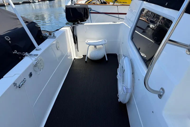 Slide: The Image of 2001 Bayliner 4087 Aft Cabin Motoryacht deck with chair and life preserver. - 6