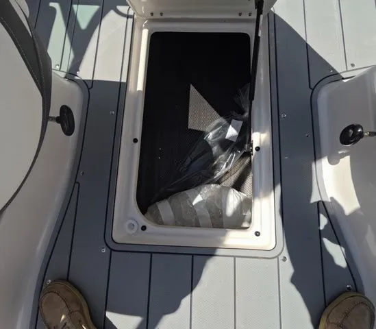 Slide: The Image of 2026 Chaparral 23 SSi OB boat storage compartment. - 20