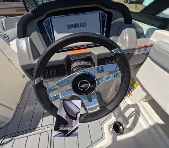 Slide: The Image of Steering wheel of 2026 Chaparral 23 SSi OB with Simrad display. - 21
