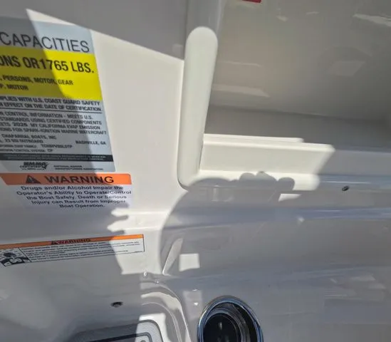 Slide: The Image of Close-up of safety warnings on a Chaparral 23 SSi OB boat. - 22