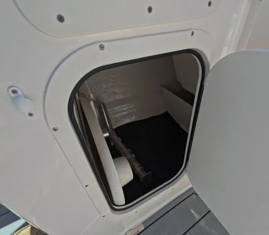 Slide: The Image of Storage compartment in Chaparral 23 SSi OB boat, 2026 model. - 25