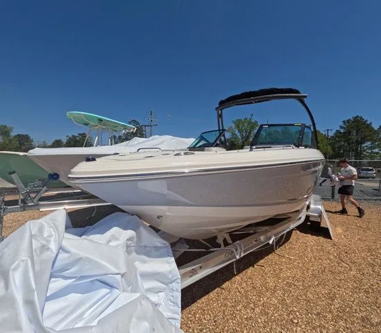 Slide: The Image of 2026 Chaparral 23 SSi OB boat on trailer outdoors. - 3