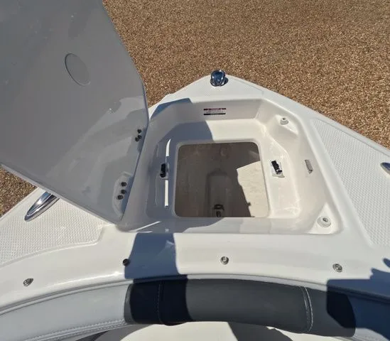 Slide: The Image of Bow storage compartment of 2026 Chaparral 23 SSi OB boat. - 31