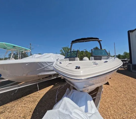 Slide: The Image of Chaparral 23 SSi OB 2026 boat with trailer, displayed outdoors. - 4