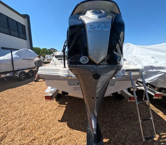 Slide: The Image of Chaparral 23 SSi OB 2026 boat with outboard motor on trailer. - 6