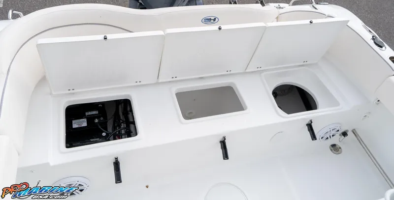 Slide: The Image of 2025 Sea Hunt Ultra 229 boat storage compartments and seating area. - 13