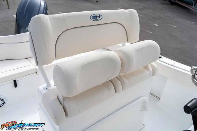 Slide: The Image of 2025 Sea Hunt Ultra 229 boat seating with white cushioned design. - 17