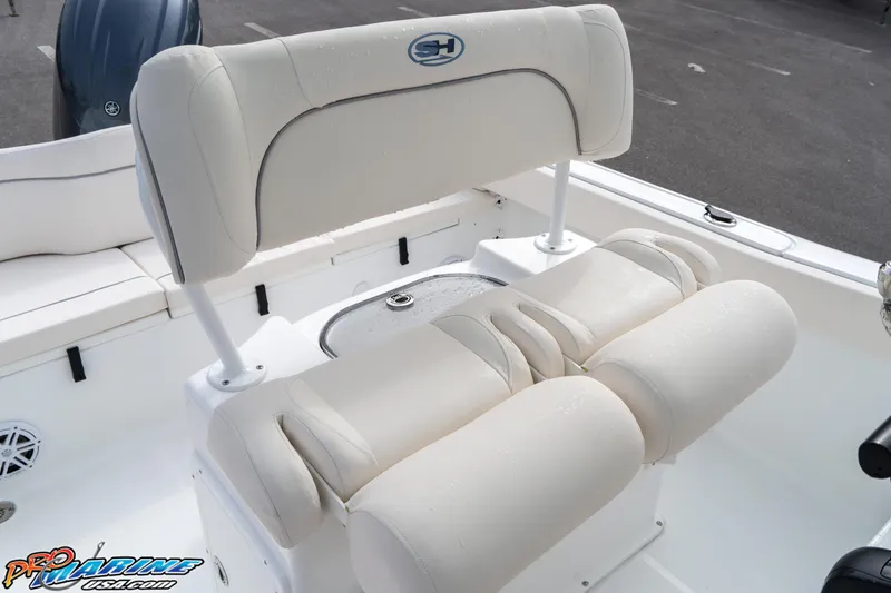 Slide: The Image of 2025 Sea Hunt Ultra 229 boat seating with cushioned backrest and armrests. - 18