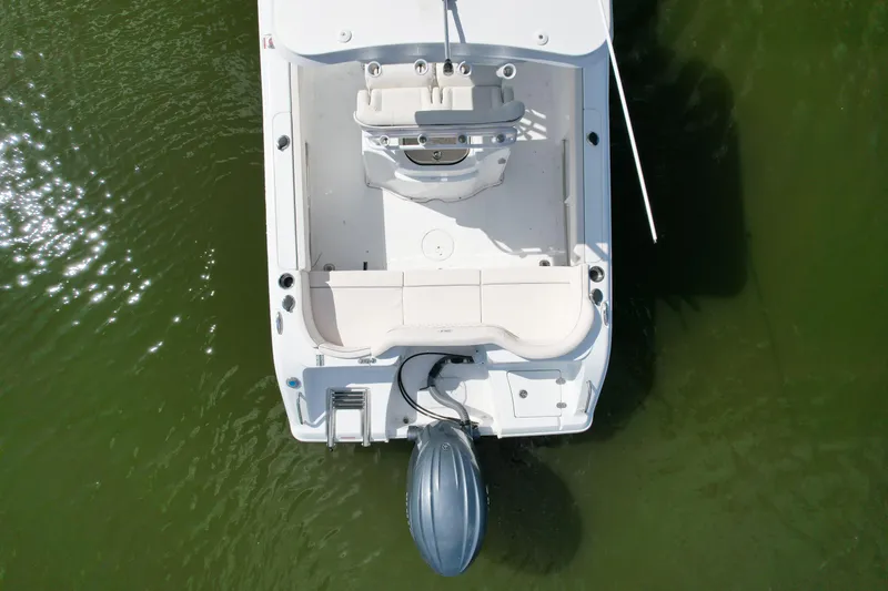 Slide: The Image of Aerial view of 2025 Sea Hunt Ultra 229 boat on green water. - 4