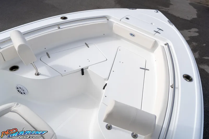 Slide: The Image of 2025 Sea Hunt Ultra 229 boat interior with white seating and storage compartments. - 5