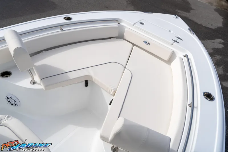 Slide: The Image of 2025 Sea Hunt Ultra 229 boat with white cushioned seating area. - 6