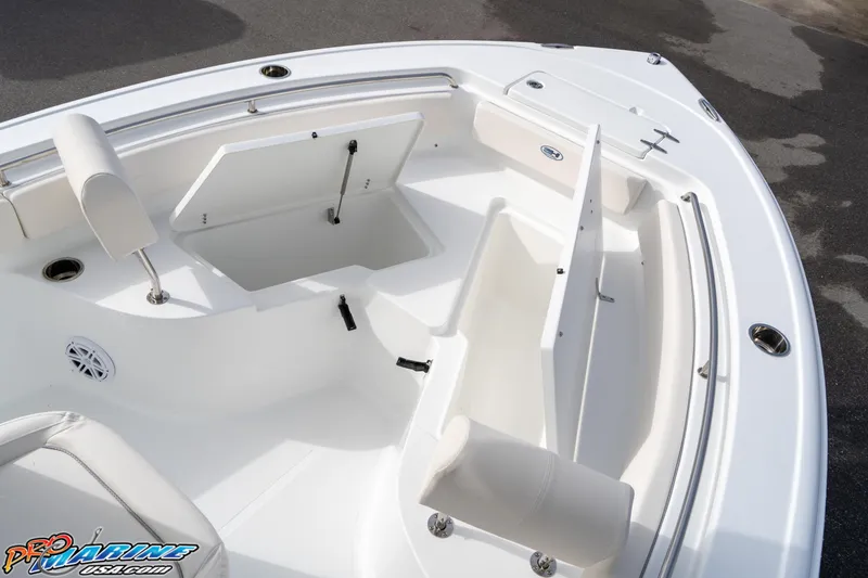 Slide: The Image of 2025 Sea Hunt Ultra 229 boat interior with open storage compartments and seating. - 8