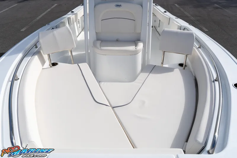 Slide: The Image of 2025 Sea Hunt Ultra 229 boat interior with cushioned seating and sleek design. - 9