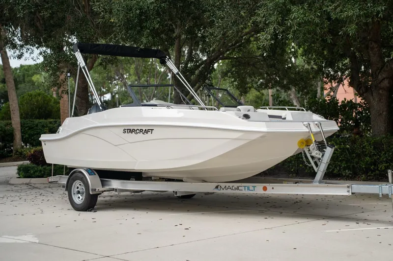Slide: The Image of 2022 Starcraft SVX 190 DC boat on trailer, parked outdoors. - 1