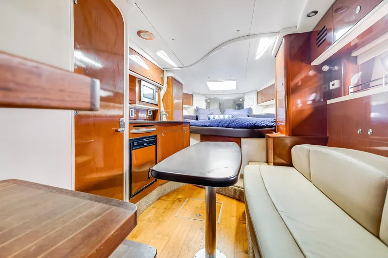 Slide: The Image of Luxurious interior of 2014 Sea Ray 330 Sundancer yacht with cozy seating and modern amenities. - 10