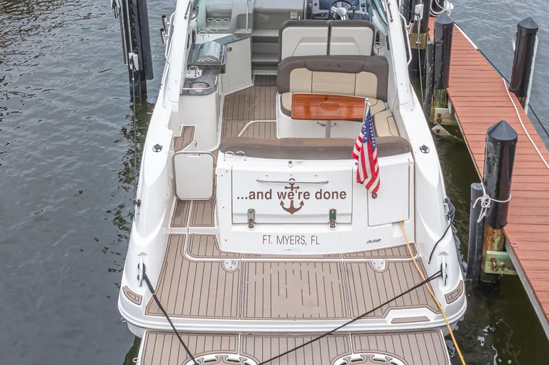 Slide: The Image of 2014 Sea Ray 330 Sundancer docked in Ft. Myers, Florida with American flag. - 4