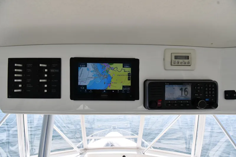 Slide: The Image of Control panel of a 1996 Ocean Yachts 53 Super Sport with navigation and communication systems. - 15