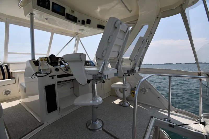 Slide: The Image of Interior view of 1996 Ocean Yachts 53 Super Sport helm with ocean backdrop. - 18