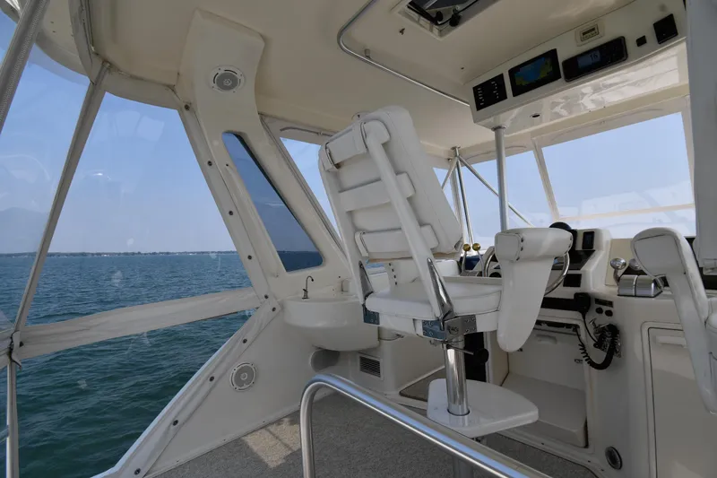 Slide: The Image of 1996 Ocean Yachts 53 Super Sport helm with ocean view and navigation equipment. - 19