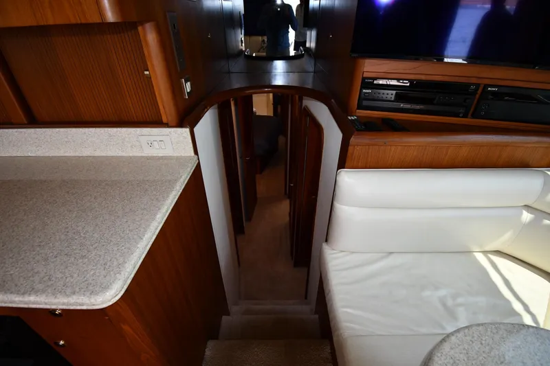 Slide: The Image of Interior of 1996 Ocean Yachts 53 Super Sport with wood finish and seating area. - 24