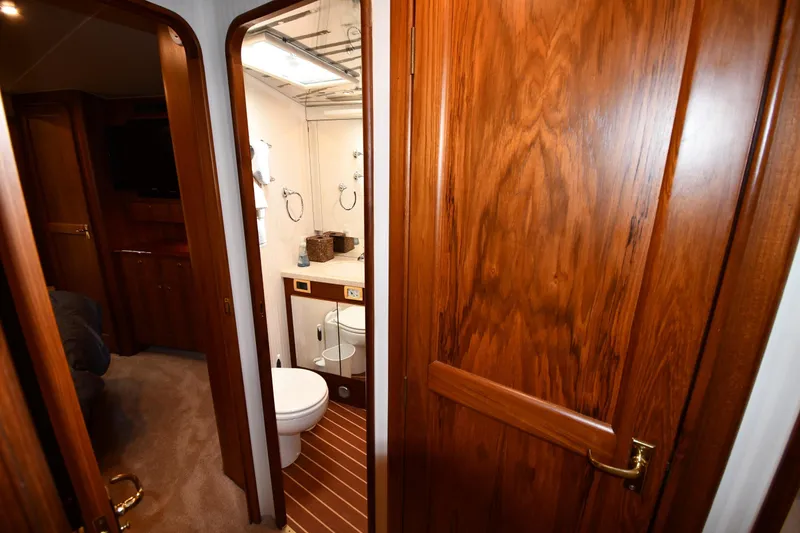 Slide: The Image of Luxurious wooden interior of 1996 Ocean Yachts 53 Super Sport bathroom and cabin. - 33