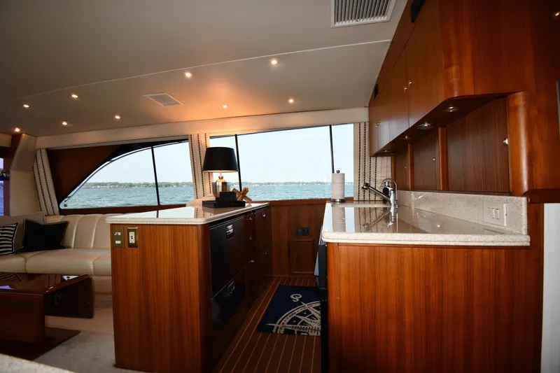 Slide: The Image of Luxurious interior of 1996 Ocean Yachts 53 Super Sport with elegant wood finishes. - 43