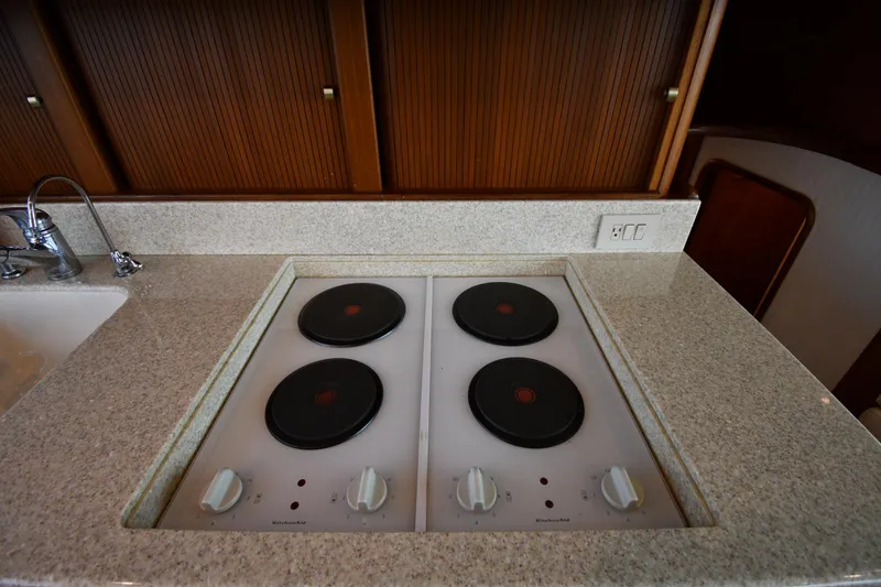 Slide: The Image of Kitchen area of 1996 Ocean Yachts 53 Super Sport with electric stove and sink. - 46