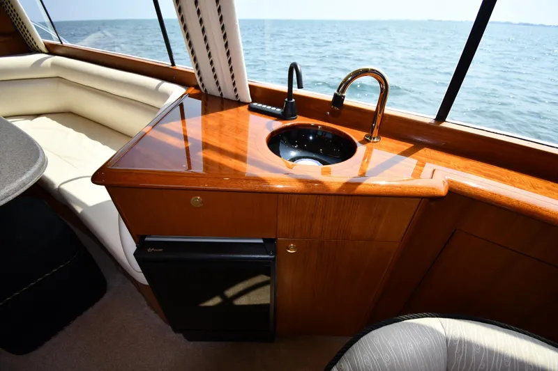 Slide: The Image of Luxurious interior of 1996 Ocean Yachts 53 Super Sport with sink and ocean view. - 53