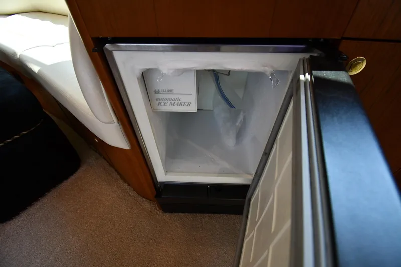 Slide: The Image of Open ice maker on 1996 Ocean Yachts 53 Super Sport, showcasing interior details. - 54