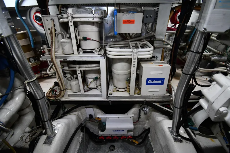 Slide: The Image of Engine room of 1996 Ocean Yachts 53 Super Sport with mechanical equipment and wiring. - 63