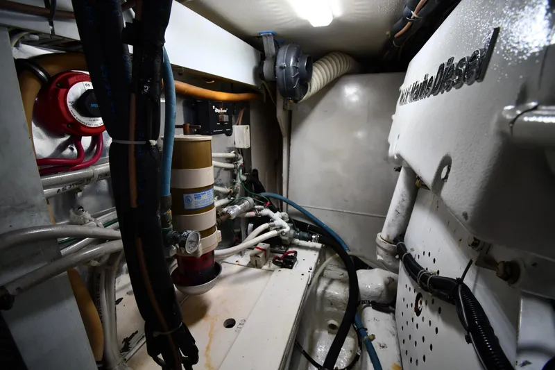 Slide: The Image of Engine room of 1996 Ocean Yachts 53 Super Sport with marine diesel components. - 64