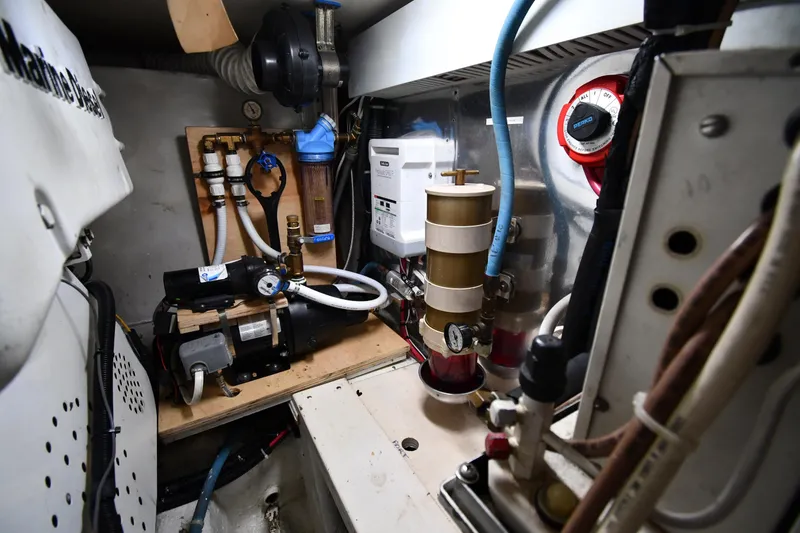 Slide: The Image of Engine room of 1996 Ocean Yachts 53 Super Sport, showcasing mechanical components and systems. - 65