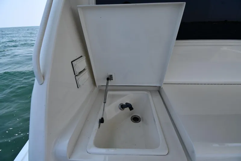 Slide: The Image of Outdoor sink on 1996 Ocean Yachts 53 Super Sport, near ocean view. - 10