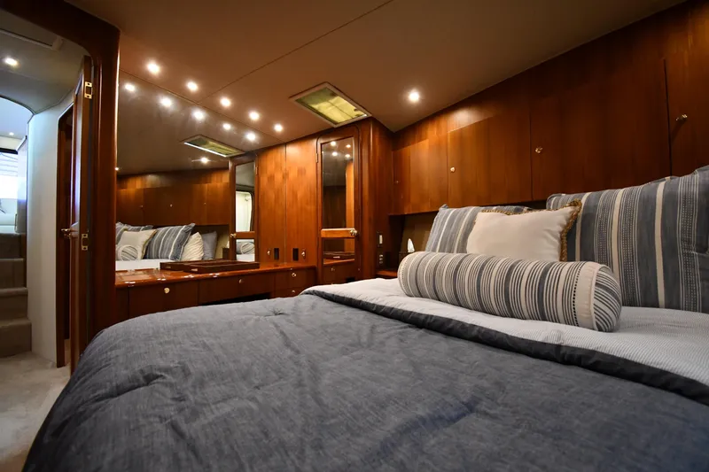 Slide: The Image of Luxurious bedroom interior of 1996 Ocean Yachts 53 Super Sport with elegant wood finish. - 28