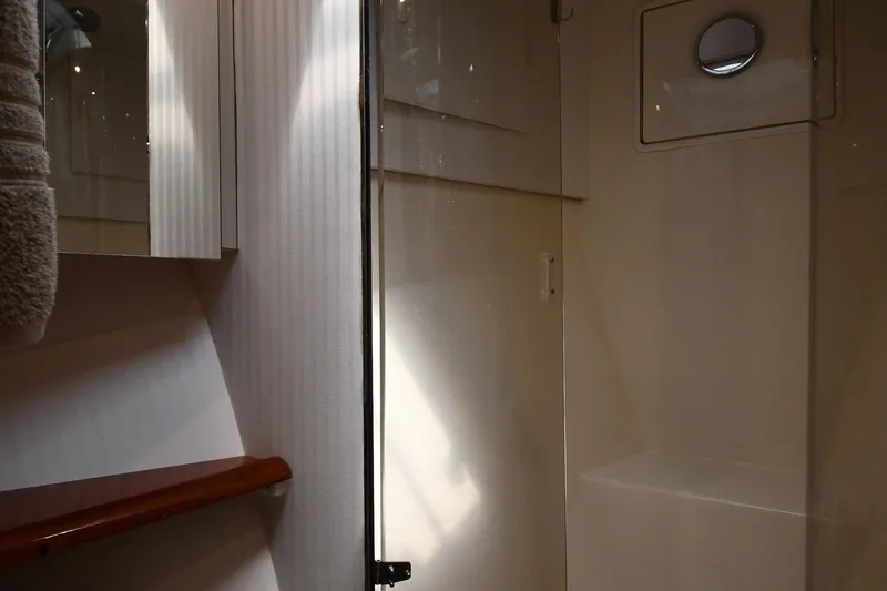 Slide: The Image of Bathroom interior of 1996 Ocean Yachts 53 Super Sport, featuring sleek design and modern fixtures. - 31