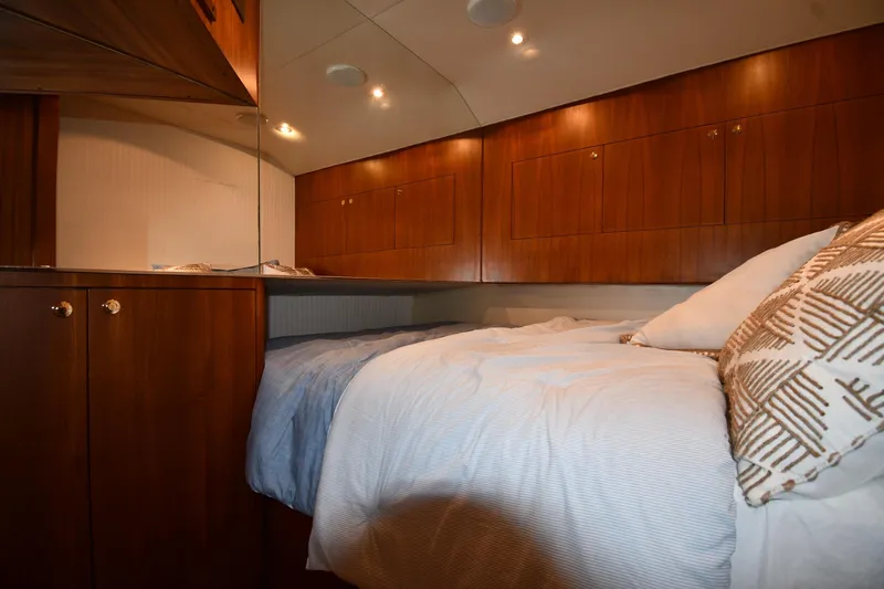 Slide: The Image of Luxurious cabin interior of 1996 Ocean Yachts 53 Super Sport with wooden cabinetry. - 36