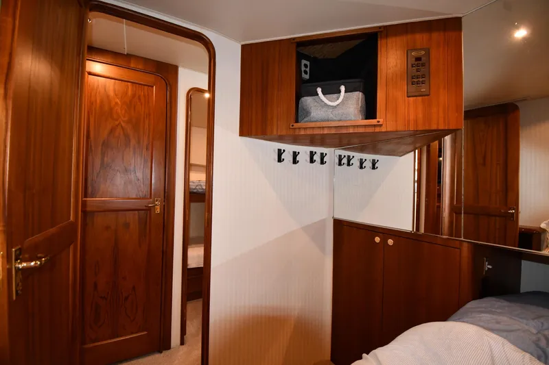 Slide: The Image of Interior of 1996 Ocean Yachts 53 Super Sport with wooden cabinetry and storage. - 37