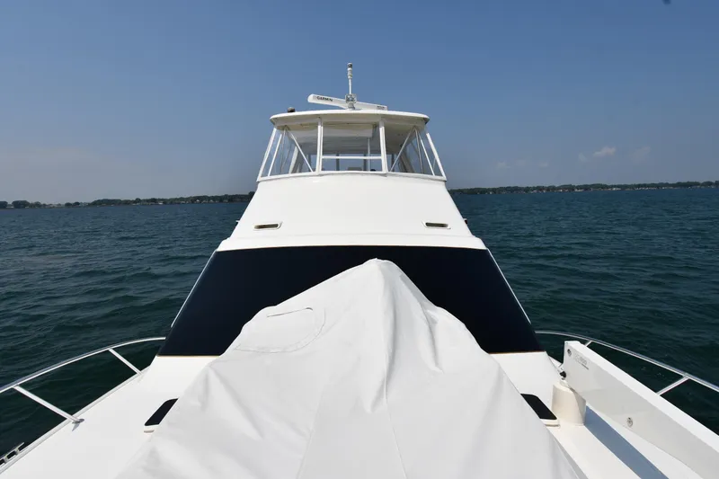 Slide: The Image of 1996 Ocean Yachts 53 Super Sport on open water, clear sky, front view. - 4