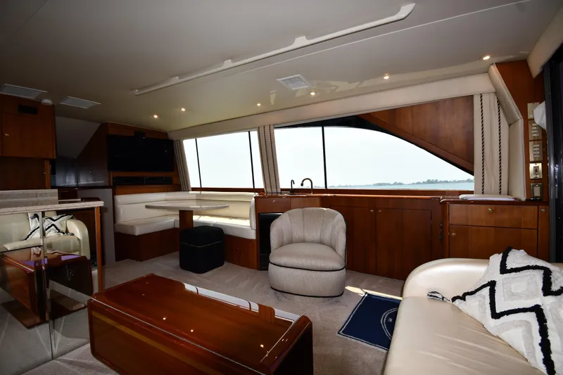 Slide: The Image of Luxurious interior of a 1996 Ocean Yachts 53 Super Sport with elegant seating and panoramic windows. - 40
