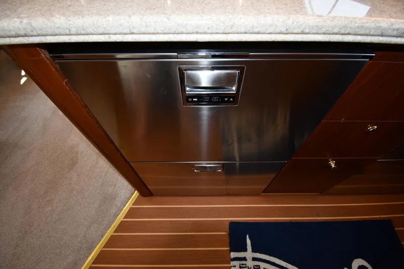 Slide: The Image of Stainless steel dishwasher in 1996 Ocean Yachts 53 Super Sport kitchen interior. - 52
