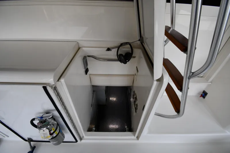 Slide: The Image of Engine room access on a 1996 Ocean Yachts 53 Super Sport, featuring safety equipment. - 59