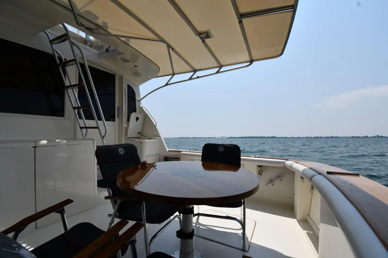 Slide: The Image of 1996 Ocean Yachts 53 Super Sport yacht deck with seating and ocean view. - 6