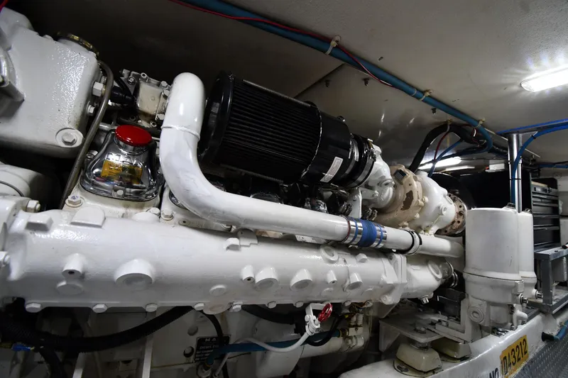 Slide: The Image of Engine room of a 1996 Ocean Yachts 53 Super Sport, showcasing detailed machinery. - 66