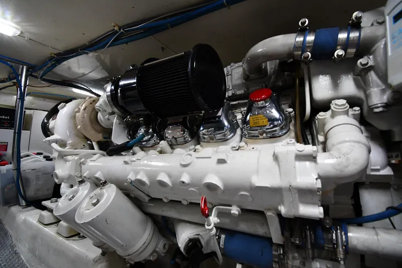 Slide: The Image of Engine room of a 1996 Ocean Yachts 53 Super Sport, showcasing detailed machinery. - 67
