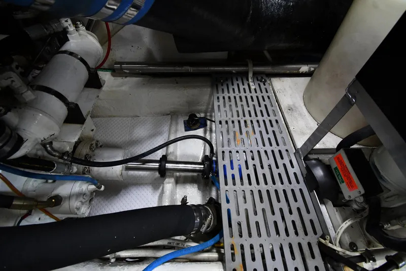 Slide: The Image of Engine room of 1996 Ocean Yachts 53 Super Sport with mechanical components and piping. - 71