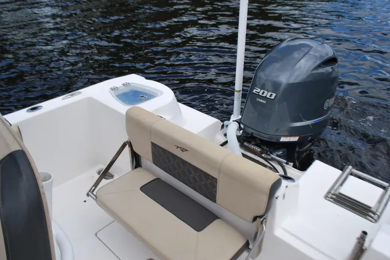 Slide: The Image of 2021 Tidewater 210 CC Adventure boat with Yamaha 200 engine on water. - 10