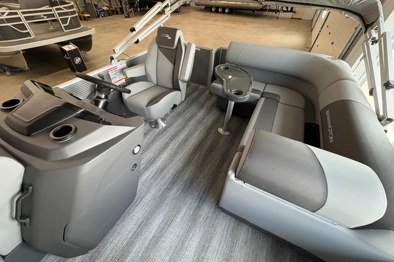 Slide: The Image of 2026 Bennington 168 SL Electric pontoon boat interior with gray seating and helm. - 8