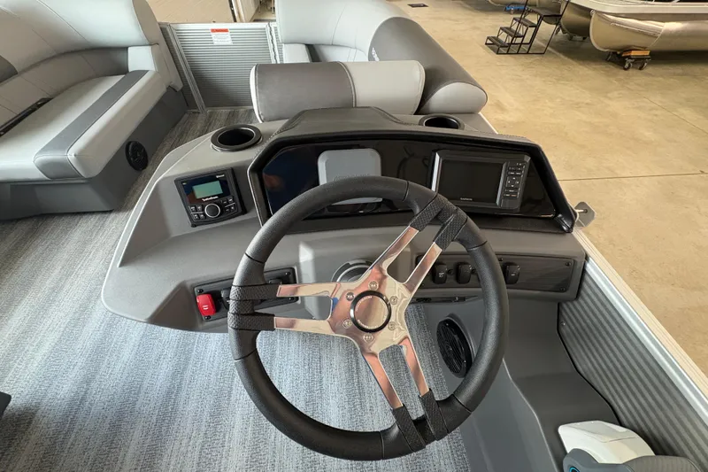 Slide: The Image of 2026 Bennington 168 SL Electric boat interior with steering wheel and control panel. - 9